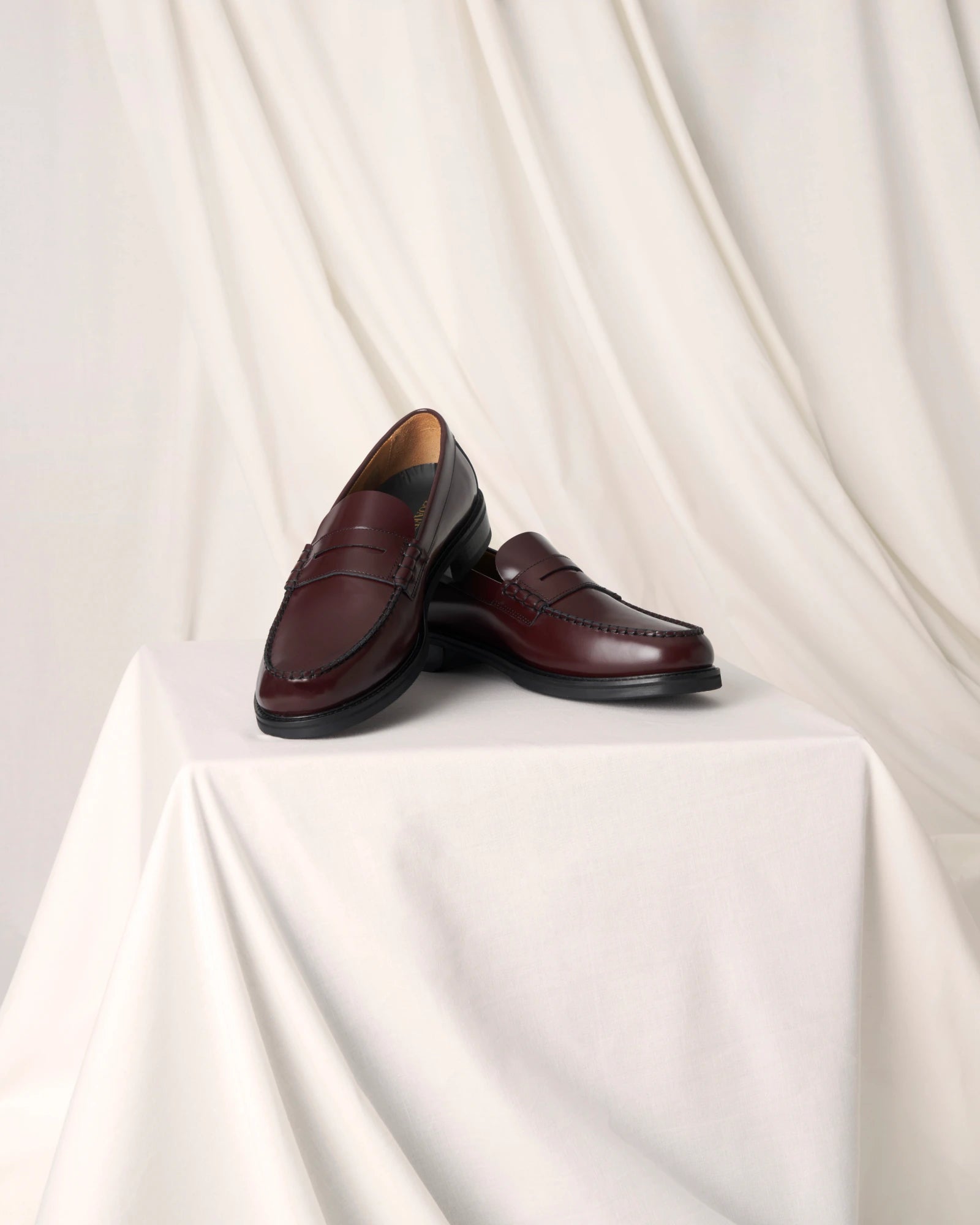Burgundy leather penny loafers for men and women